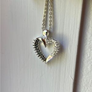 Sterling silver chain and heart pendant. Faux black and clear stones